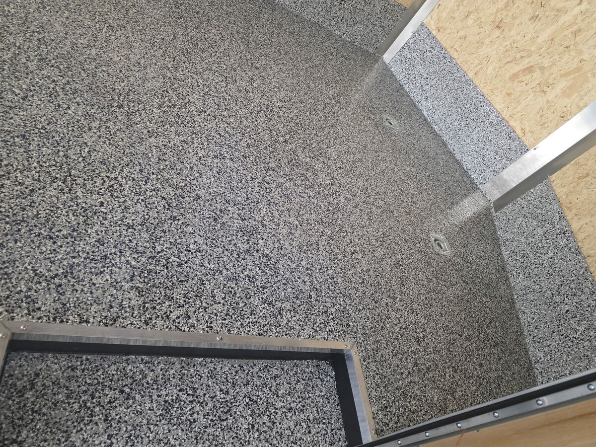 Flake epoxy coating in an enclosed trailer